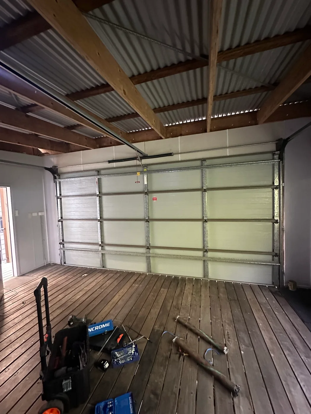 Garage door repair in Palm Beach — Noisy sectional door operation